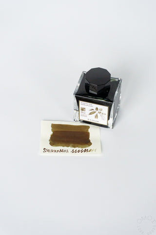 Sailor Shirakashi ink bottle with swatch on a white background