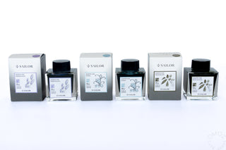 Sailor bottled ink set of multiple clear bottles with black caps and assorted labels
