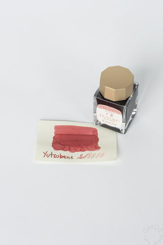 Sailor ink bottle with rose pink swatch on a white background