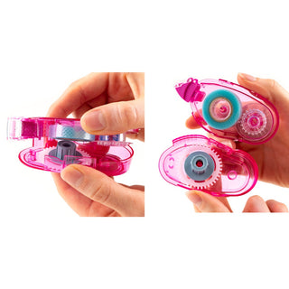 Pink correction tape dispenser held by a hand on a white background