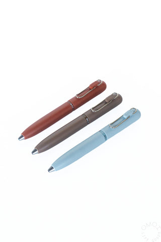 Multi-color gel pen set with brick red, gray, and light blue barrels