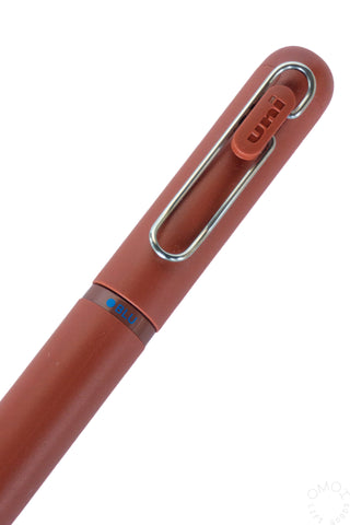 Brick red gel pen with chrome clip and grip band label