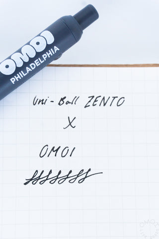 Uni-Ball Zento X OMOI Philadelphia written on a notebook