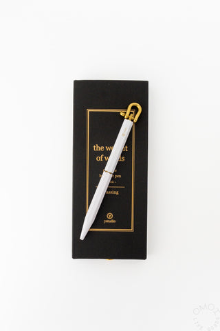 ystudio white pen on black box on a white background