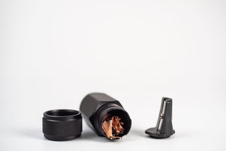 Side angle of blackwing sharpener, opened with pencil shavings
