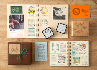 Craft stamp book pages with stickers, stamps, and sample cards