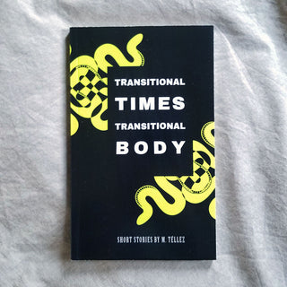 Black book with neon yellow “TRANSITIONAL TIMES” and “TRANSITIONAL BODY” cover