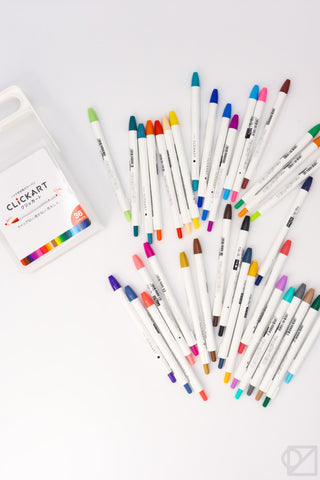 36-color ZEBRA CLiCKART retractable markers laid out with white barrel bodies