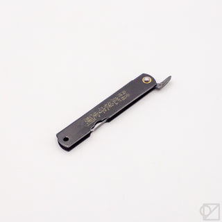 Pocket knife with black handle and satin blade, featuring gold center pin