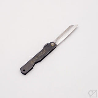 Pocket knife with satin blade extended, black handle and gold pin detail