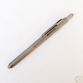 Gunmetal gray multi-pen with textured grip and side switch, angled view