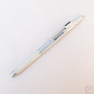 White multi-pen with textured grip and side switch, angled view