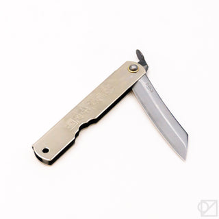 Pocket knife open with chrome blade, dark handle scale, and brass center rivet
