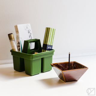 Brown square incense burner bowl with incense stick, open top